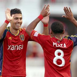 RSL's Javier Morales and Joao Plata celebrate one of their team's goals in an MLS game between Real Salt Lake and San Jose at Rio Tinto Stadium in Sandy on Saturday, June 1, 2013. RSL beat the Earthquakes 3-0.