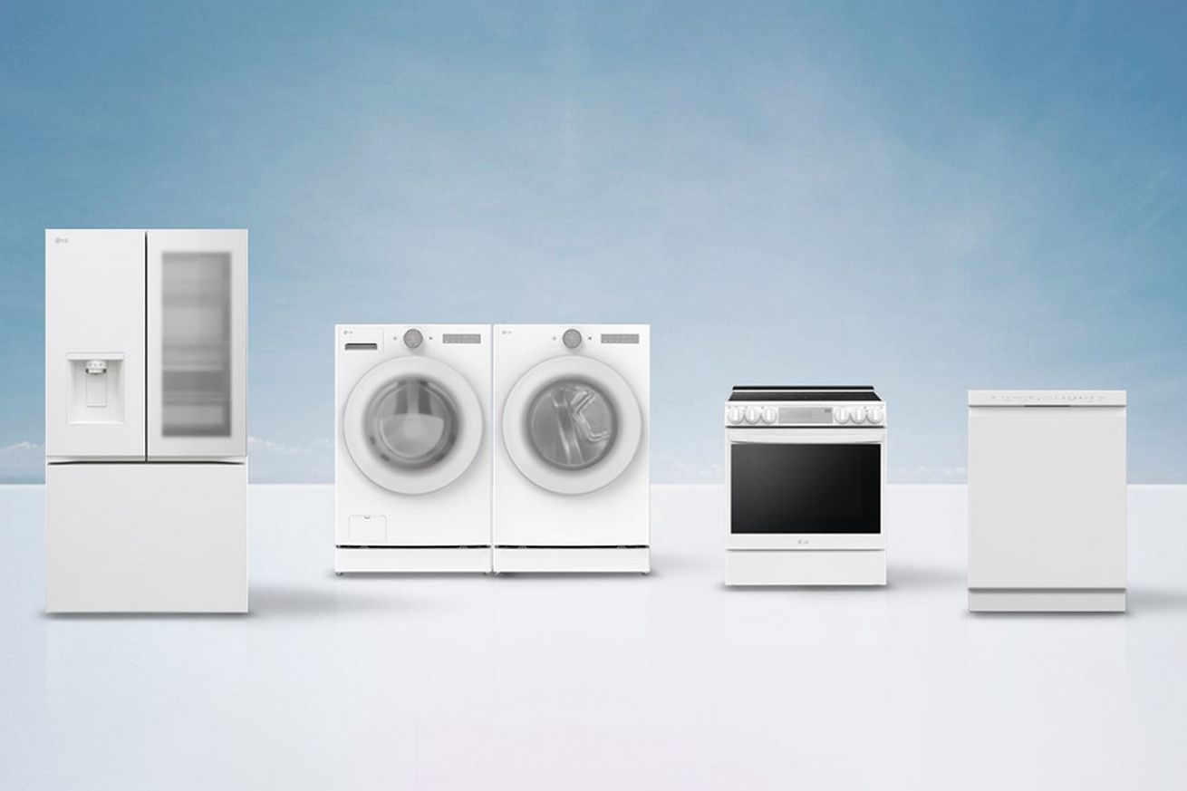 Photo of LG’s all white fridge, washing machine, dryer, oven, and dishwasher showing cleaner design on white and blue background.