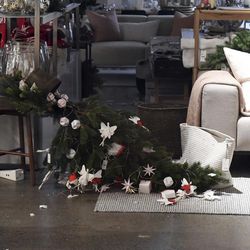 A christmas tree lies on its side in a shop in Wellington after a 6.6 earthquake based around Cheviot in the South island shock the capital, New Zealand, Monday, Nov. 14, 2016. A powerful earthquake struck New Zealand near the city of Christchurch early Monday, with strong jolts causing some damage to buildings over 200 kilometers (120 miles) away in the capital, Wellington. 