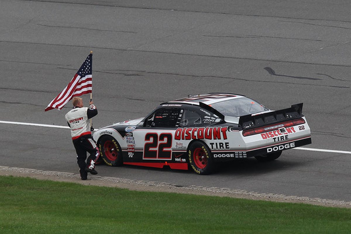 Brad Keselowski celebrates winning the NASCAR Nationwide Series Carfax 250 at Michigan International Speedway.