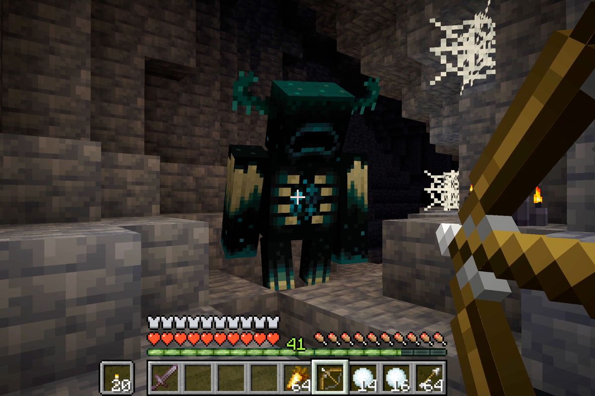 Minecraft - a spooky Warden shows up in a cave underground.