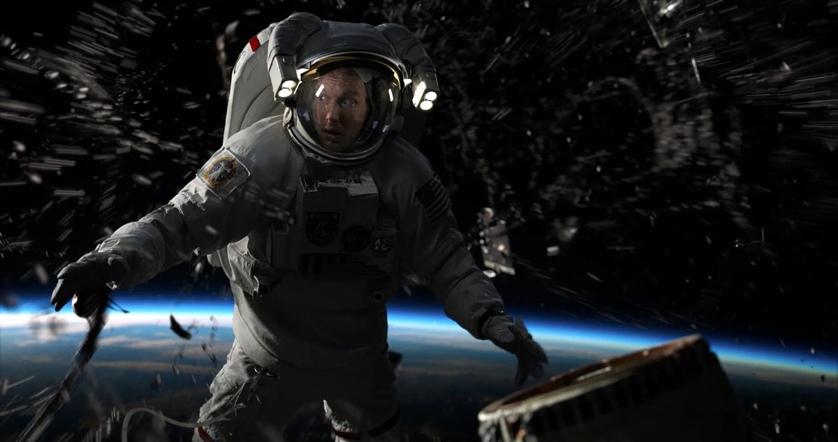Patrick Wilson looks surprised in outer space in his astronaut uniform in Moonfall