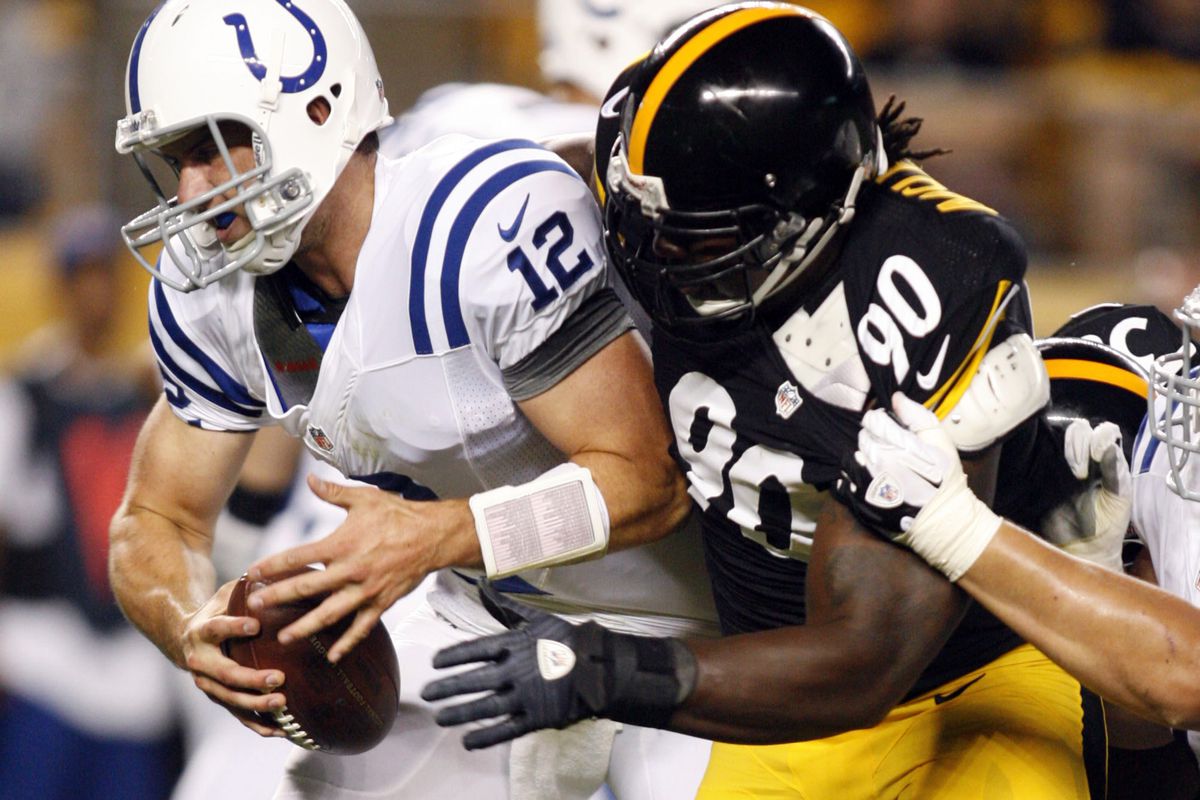 August 19, 2012; Pittsburgh, PA, USA; Indianapolis Colts quarterback Andrew Luck (12) is sacked by Pittsburgh Steelers defensive tackle Steve McLendon (90) during the first quarter at Heinz Field. Mandatory Credit: Charles LeClaire-US PRESSWIRE