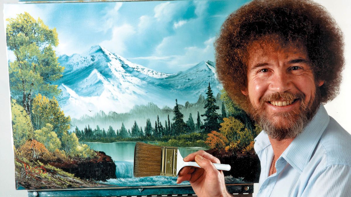 Artist Bob Ross at a canvas holding a paint brush.