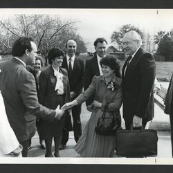 Elder L. Tom Perry and his wife, Barbara, are greeted by leaders of the Gridley California Stake and their wives in March 1987.