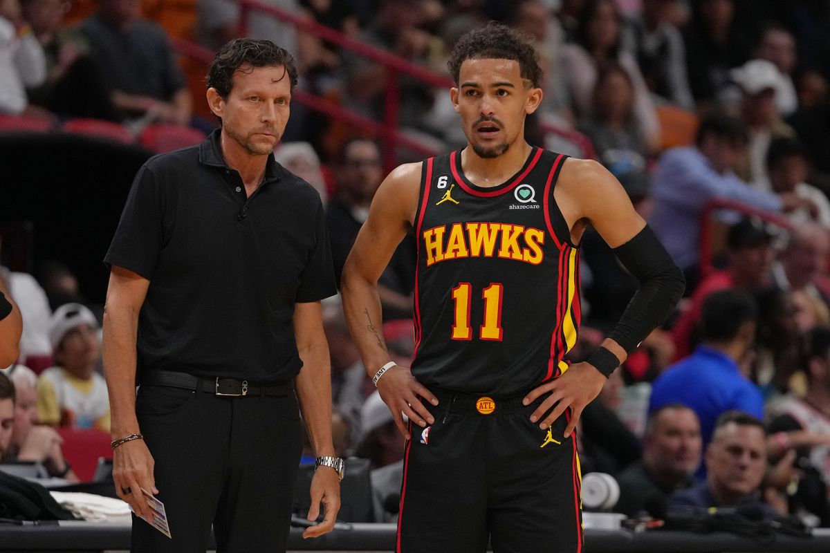 Quinn Snyder and Trae Young #11 of the Atlanta Hawks look on against the Miami Heat on April 11, 2023 at Kaseya Center in Miami, Florida.&nbsp;