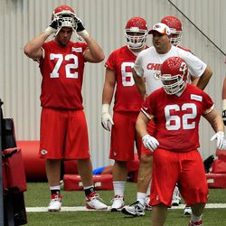 Number one overall draft pick Eric Fisher #72 removes his helmet while practicing during Kansas City Chiefs rookie camp at Kansas University Hospital Training Center on May 10, 2013 in Kansas City, Missouri.