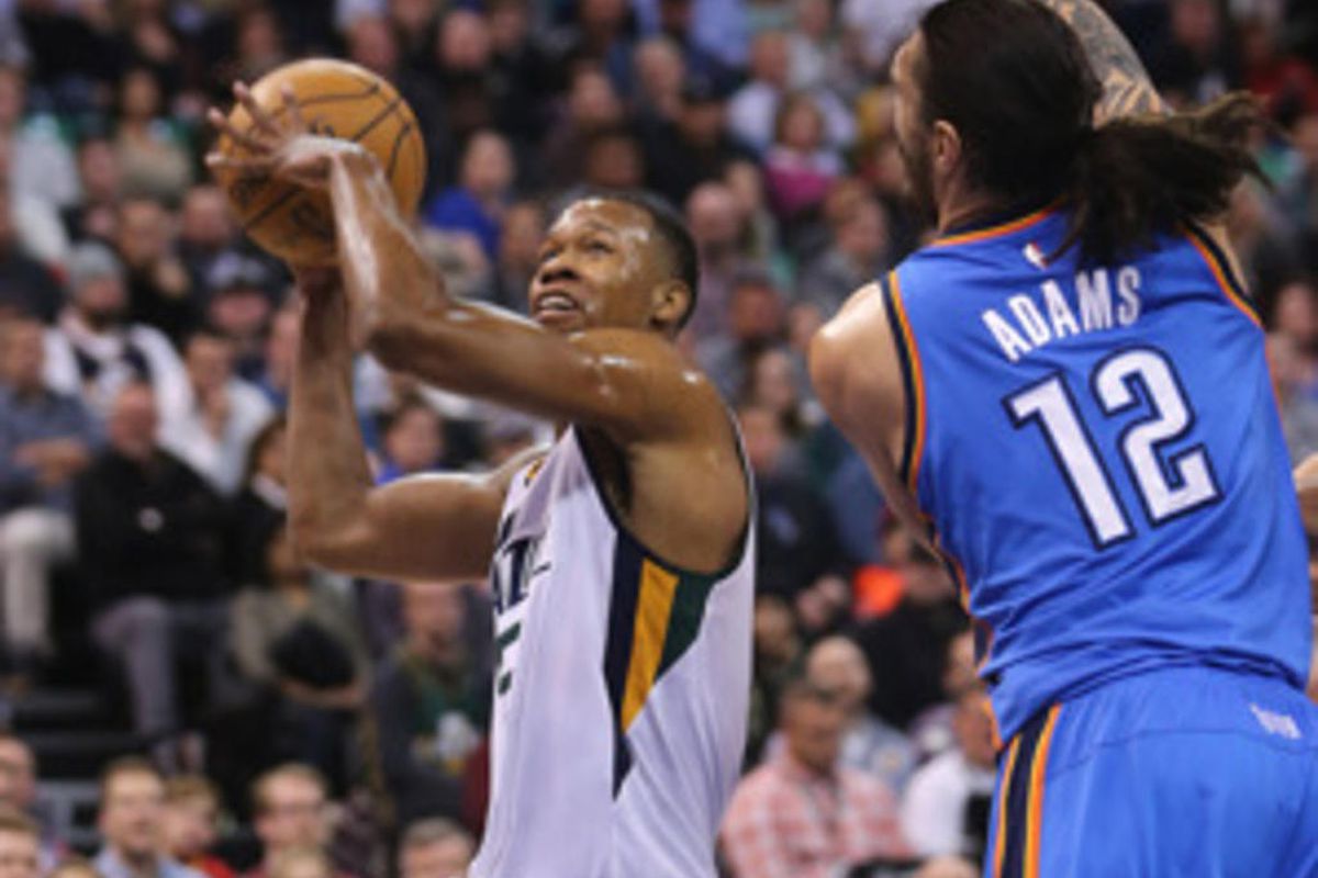 Utah Jazz guard Rodney Hood (5) tries to put up a shot over Oklahoma City Thunder center Steven Adams (12) as the Jazz and the Thunder play at Vivint Smart Home arena in Salt Lake City on Wednesday, Dec. 14, 2016.  