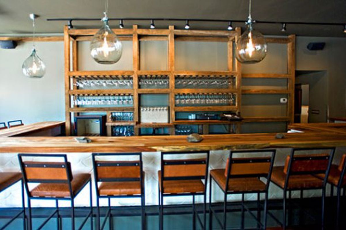 A front view of the bar with glass pendants