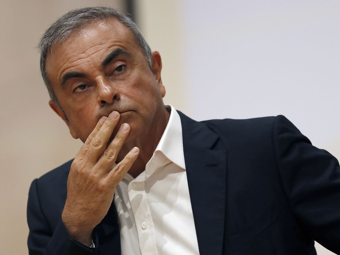 In this Sept. 29, 2020, file photo, former Nissan Motor Co. Chairman Carlos Ghosn holds a press conference at the Maronite Christian Holy Spirit University of Kaslik, as he launches an initiative to help Lebanon that is undergoing a severe economic and financial crisis, in Kaslik, north of Beirut, Lebanon. 