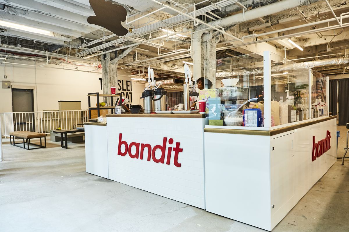 A cafe counter with the red logo saying “Bandit”
