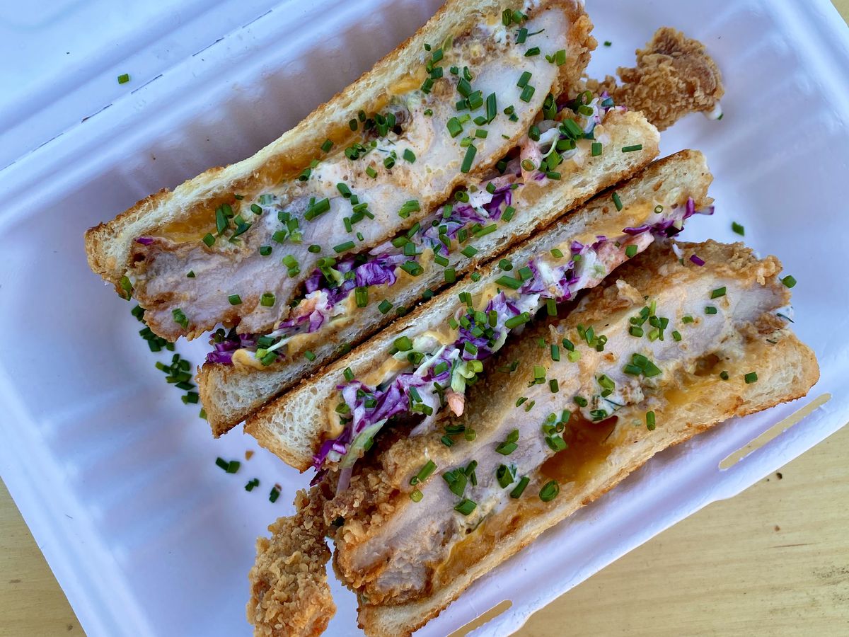 Fried chicken melt at Jojo is american and cheddar cheeses, crystal hot sauce, house ranch, coleslaw, butter toasted shokupan