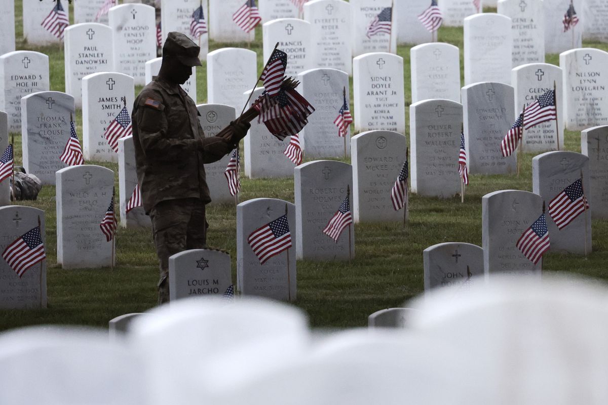 Annual Flags-In Event Held At Arlington Cemetery Ahead Of Memorial Day