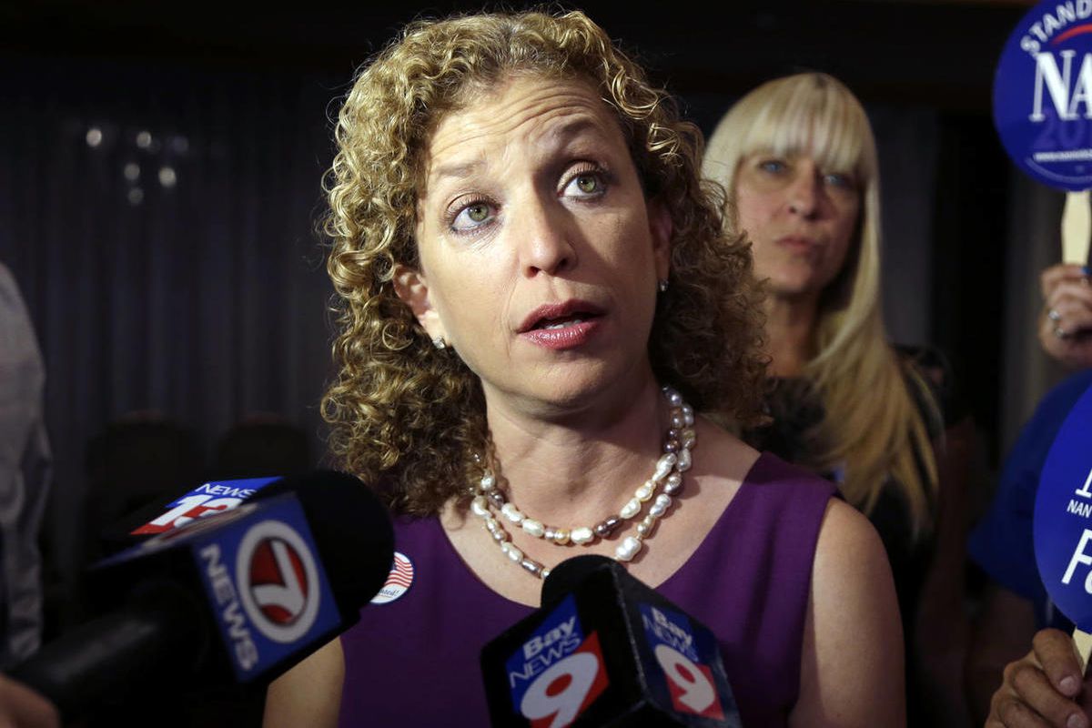 In this Aug. 26, 2014 file photo, Democratic National Committee Chairwoman, Rep. Debbie Wasserman Schultz, D-Fla.  speaks to the news media in Weston, Fla. Democrats are struggling to answer a simple question — "What's a Democrat?" — and must do a better 