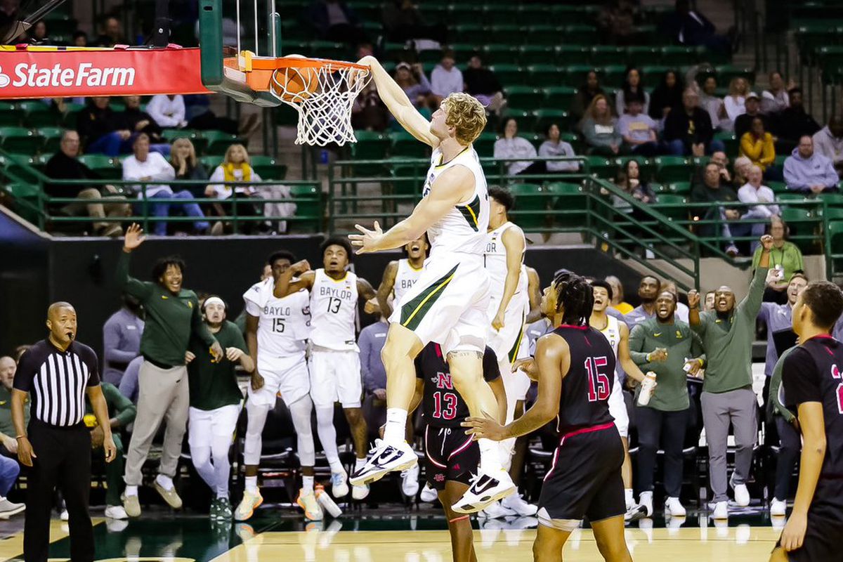 Caleb Lohner slams it home against a very defeated Nichols State basketball team.