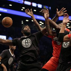 Brooklyn Nets' Reggie Evans, left, fights for a rebound during the first half of the NBA basketball game against the Chicago Bulls at the Barclays Center Wednesday, Dec. 25, 2013, in New York. 