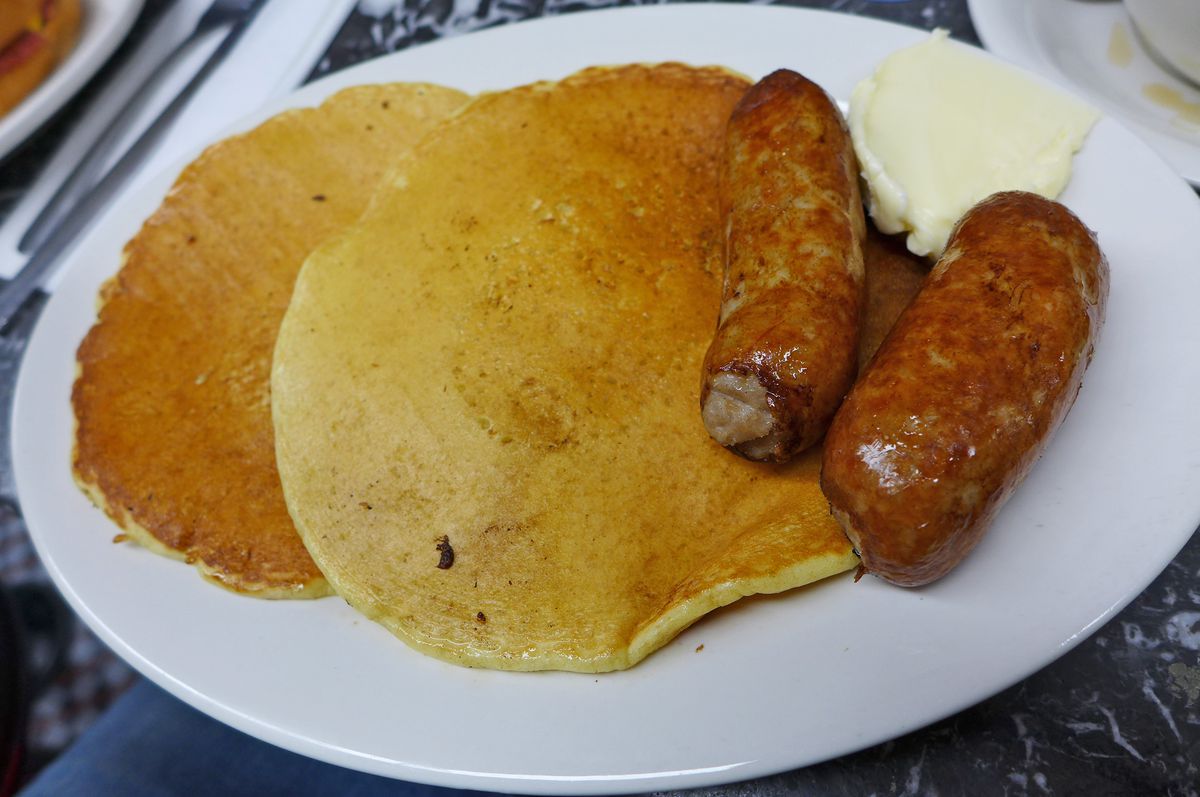 Two pancakes, two thick sausage links.