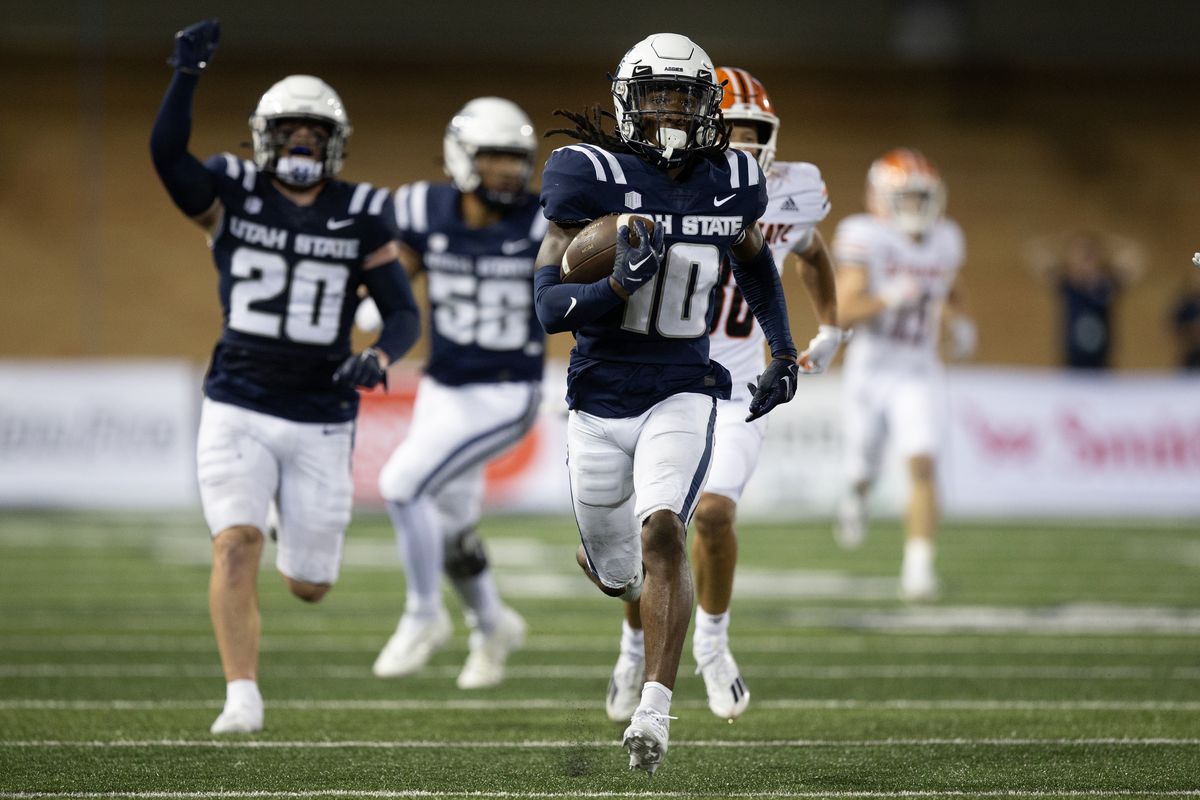 Jaiden Francois of the Utah State Aggies runs back an interception for a touchdown against the Idaho State Bengals during the second half of their game at Maverik Stadium September 9, 2023 in Logan, Utah.