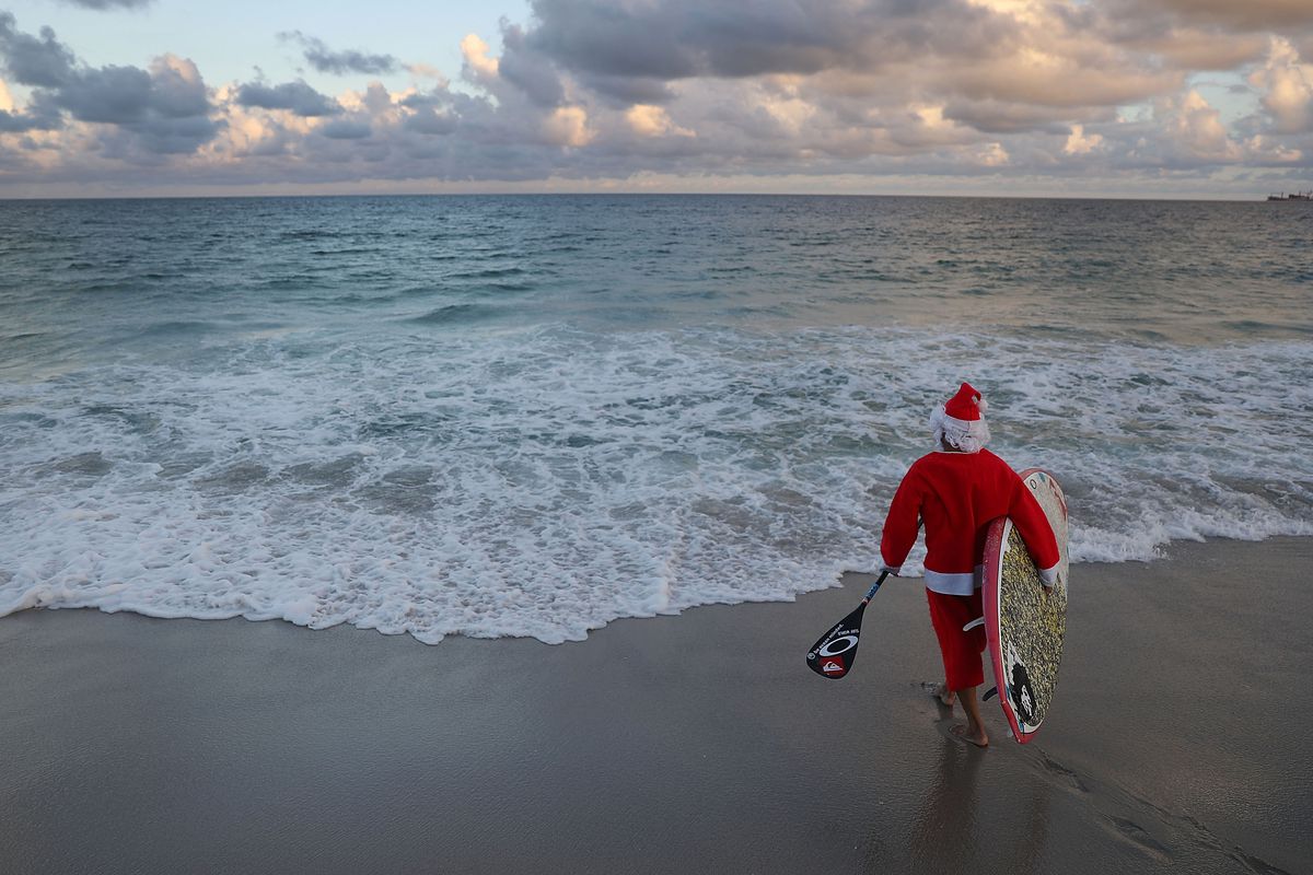 Surfing Santa Enjoys The Waves In Fort Lauderdale