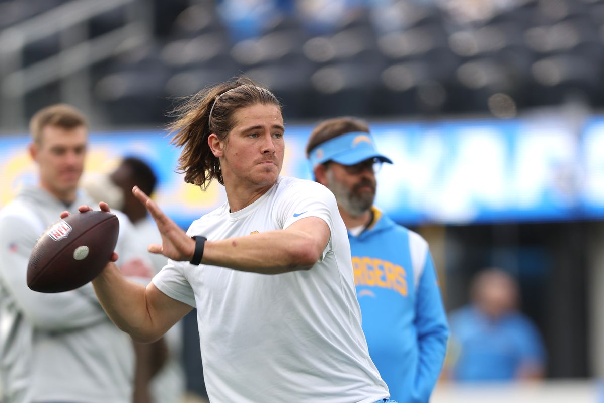 Justin Herbert #10 of the Los Angeles Chargers warms up prior to the game against the Los Angeles Rams at SoFi Stadium on January 01, 2023 in Inglewood, California.
