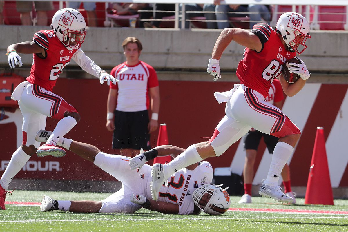 Utah Utes tight end Brant Kuithe (80) breaks a tackle by Idaho State Bengals linebacker Kennon Smith (31) and goes in for a touchdown against the Idaho State Bengals during NCAA football in Salt Lake City on Saturday, Sept. 14, 2019.