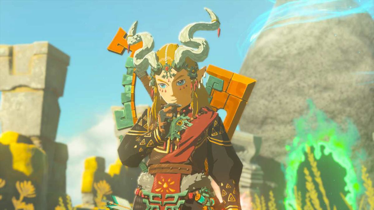 Link stands with a thinking pose wearing the full Ember Armor set in Zelda: Tears of the Kingdom. The headwear gives him curvy horns and long hair.