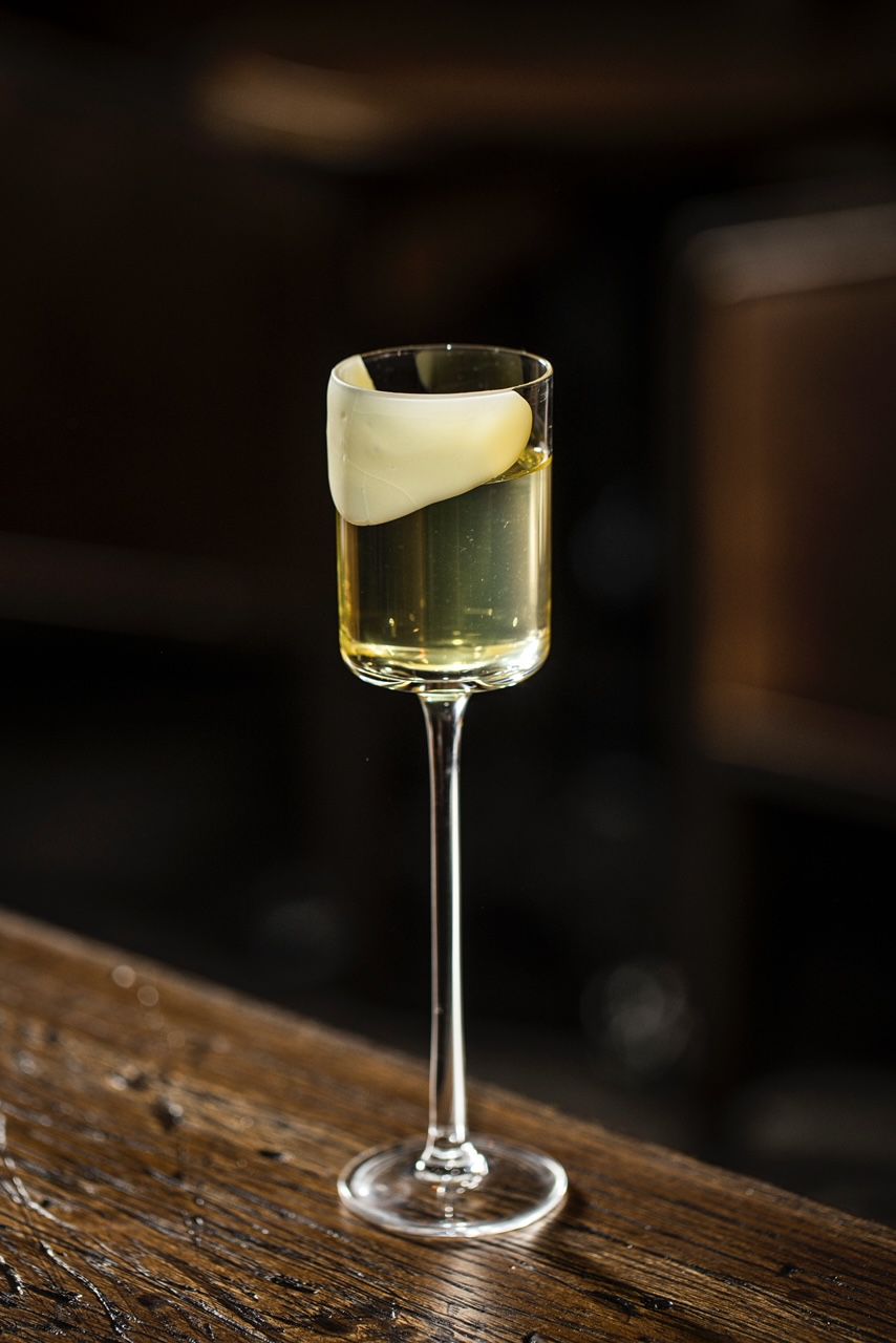 A delicate cocktail with a lemony egg white garnish.