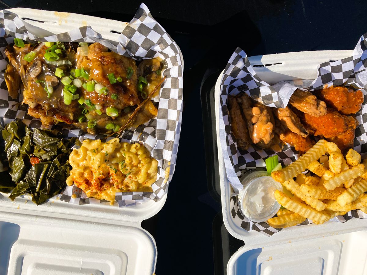A takeout container is filled with chicken thighs in a mushroom gravy, with a side of collard greens and a scoop of mac and cheese. To the right, another takeout container is filled with red-hued wings. Both takeout containers are from Erica’s Soul Food, the Portland, Oregon cart on SE 82nd.