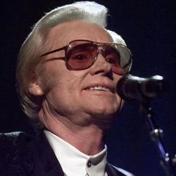 FILE - In this June 1, 1999 file photo, Country music legend George Jones is shown during a performance in Nashville.  Jones, the peerless, hard-living country singer who recorded dozens of hits about good times and regrets and peaked with the heartbreaking classic "He Stopped Loving Her Today," has died. He was 81. Jones died Friday, April 26, 2013 at Vanderbilt University Medical Center in Nashville after being hospitalized with fever and irregular blood pressure, according to his publicist Kirt Webster. 