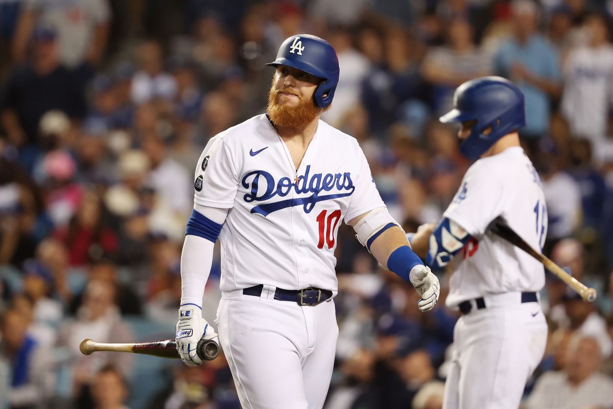 Justin Turner #10 of the Los Angeles Dodgers reacts after striking out in the eighth inning against the St. Louis Cardinals during the National League Wild Card Game at Dodger Stadium on October 06, 2021 in Los Angeles, California.