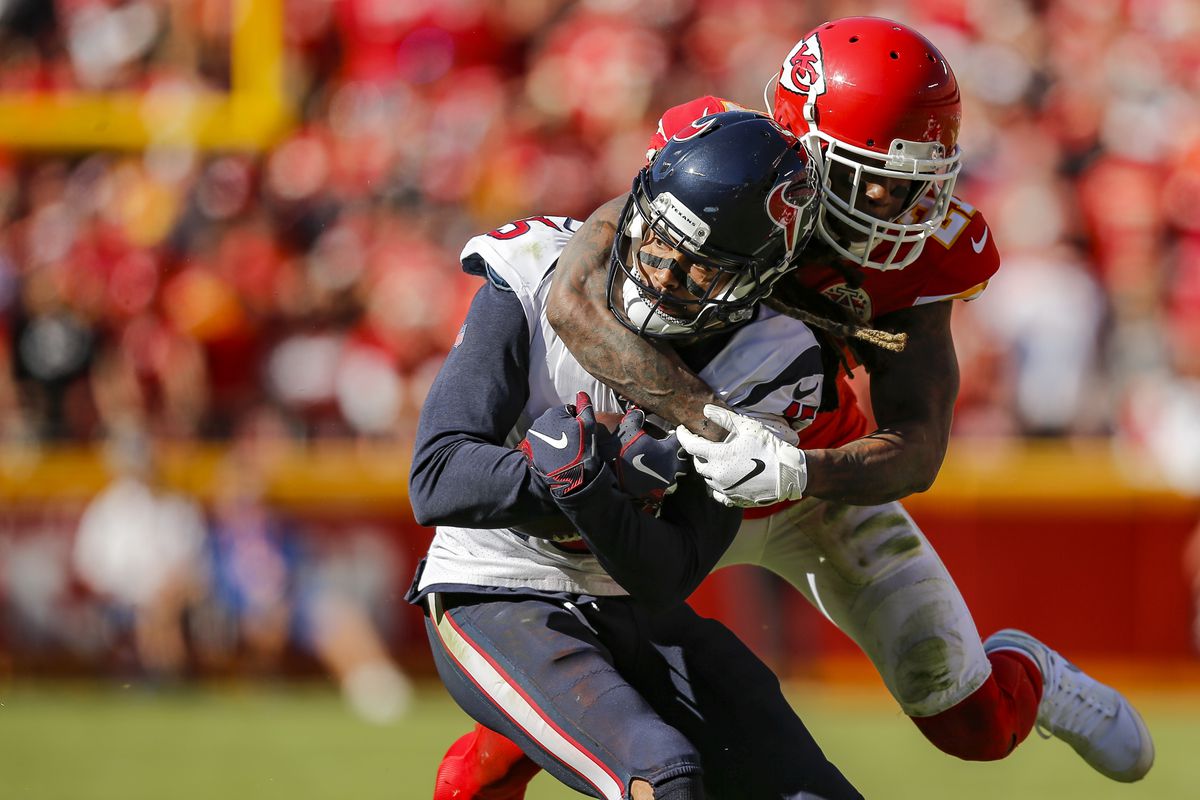 Bashaud Breeland of the Kansas City Chiefs tackles Will Fuller of the Houston Texans in the fourth quarter at Arrowhead Stadium on October 13, 2019 in Kansas City, Missouri.