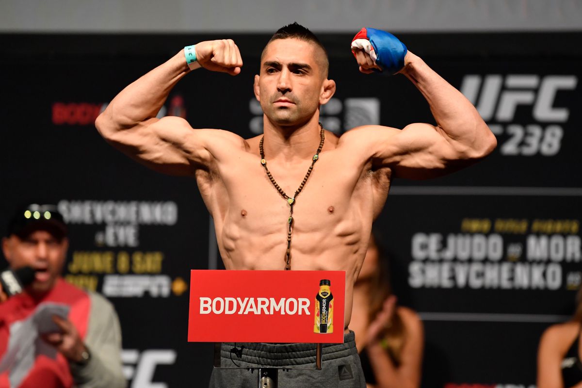 Ricardo Lamas poses on the scale during the UFC 238 weigh-in at the United Center on June 7, 2019 in Chicago, Illinois.
