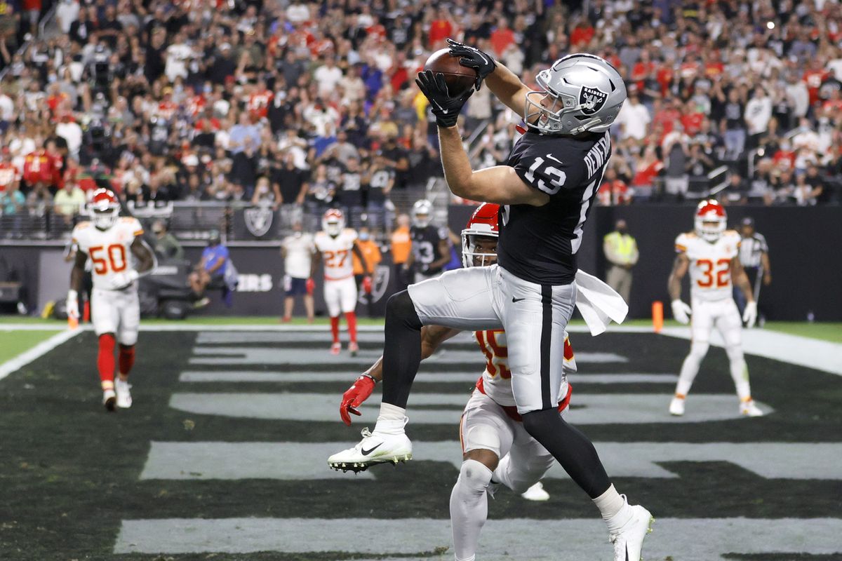 Wide receiver Hunter Renfrow #13 of the Las Vegas Raiders catches a 6-yard touchdown pass against cornerback Charvarius Ward #35 of the Kansas City Chiefs during their game at Allegiant Stadium on November 14, 2021 in Las Vegas, Nevada. The Chiefs defeated the Raiders 41-14.