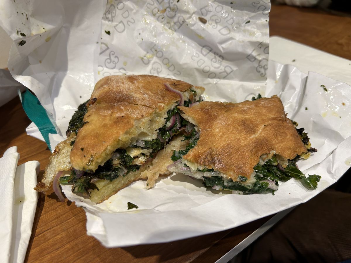 Two halves of kale salad sandwich from R&amp;D Foods in Brooklyn, New York.
