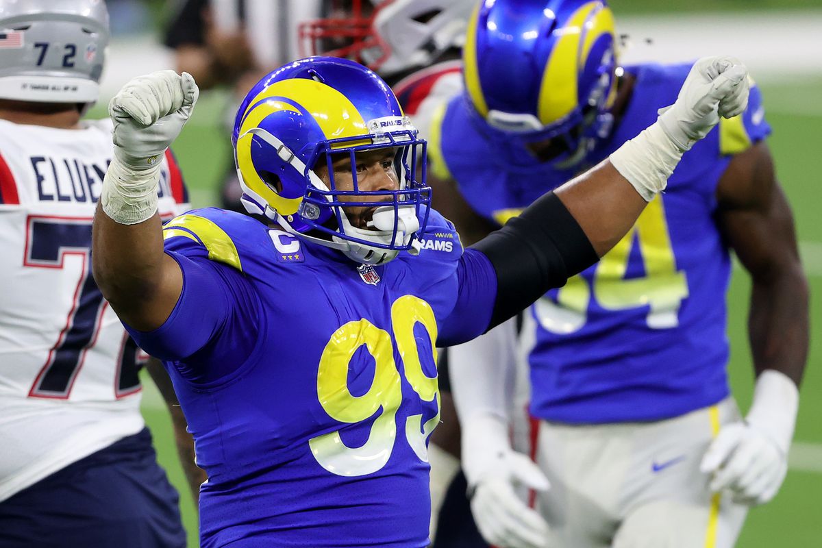 Aaron Donald #99 of the Los Angeles Rams celebrates a turnover on downs during the fourth quarter in the game against the New England Patriots at SoFi Stadium on December 10, 2020 in Inglewood, California.