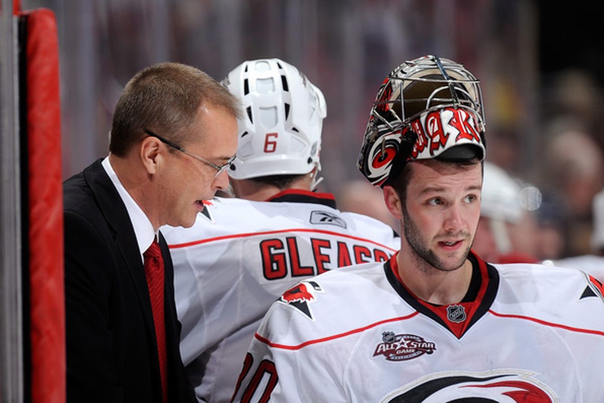 Head coach Paul Maurice of the Carolina Hurricanes talks with Cam Ward #30.  The Carolina netminder will be relied upon to carry much, if not all of the load down the stretch for the Canes. 