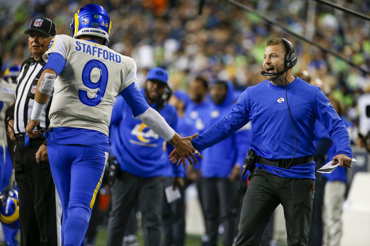 Los Angeles Rams head coach Sean McVay (right) celebrates with quarterback Matthew Stafford (9) following a touchdown against the Seattle Seahawks during the fourth quarter at Lumen Field.