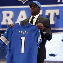 Ezekiel Ansah, from Brigham Young, holds up a team jersey after being selected fifth overall by the Detroit Lions in the first round of the NFL football draft, Thursday, April 25, 2013, at Radio City Music Hall in New York. 