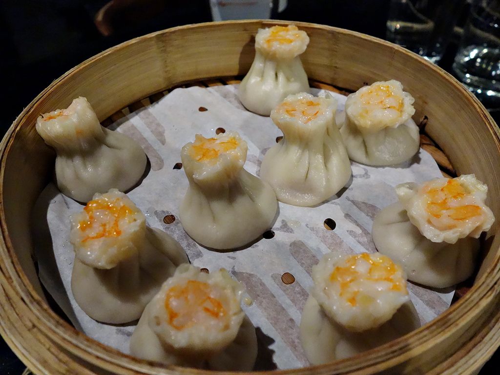A steamer basket filled with dumplings.