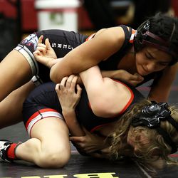 Rachel Camacho of American Leadership Academy takes Annika Futch of Park City to the mat as they wrestle in the 108 weight class at the 5A/3A/2A/1A girls wrestling state championship meet at Mountain View High School in Orem on Wednesday, Feb. 17, 2021.