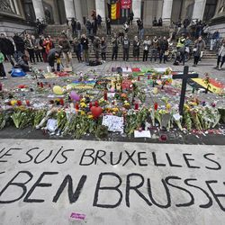 A banner for the victims of the bombings reads " I am Brussels" at the Place de la Bourse in the center of Brussels, Wednesday, March 23, 2016. Bombs exploded yesterday at the Brussels airport and one of the city's metro stations Tuesday, killing and wounding scores of people, as a European capital was again locked down amid heightened security threats. 