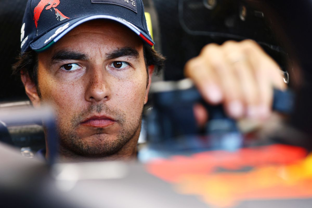 Sergio Perez of Mexico and Oracle Red Bull Racing looks on from his car in the garage during previews ahead of the F1 Grand Prix of The Netherlands at Circuit Zandvoort on September 01, 2022 in Zandvoort, Netherlands.  