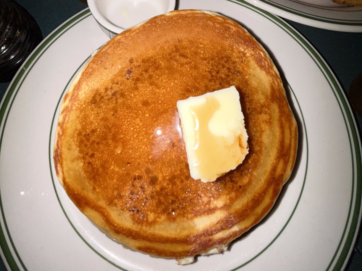 An overhead photograph, taken with flash, of an order of pancakes at Three Decker Diner.