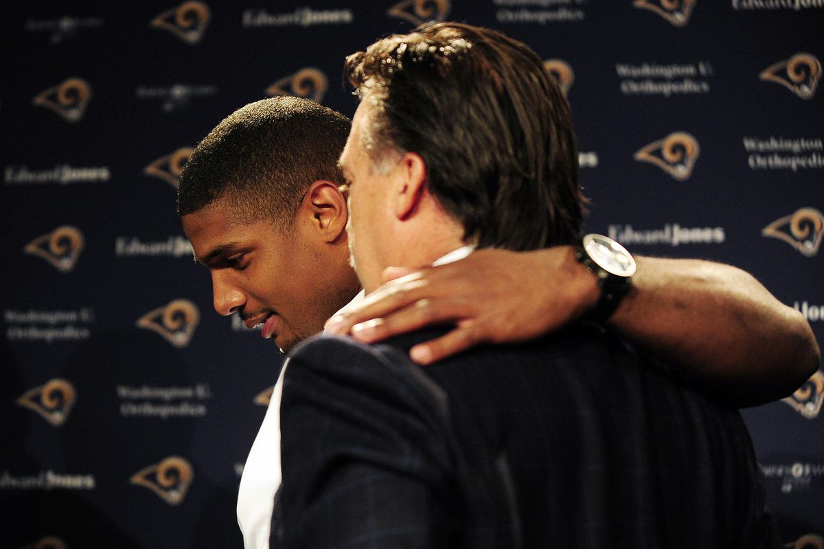 Michael Sam, left, with Rams coach Jeff Fisher