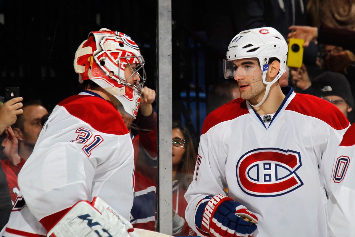 UNIONDALE, NY - DECEMBER 14: Carey Price #31 and Max Pacioretty #67 of the Montreal Canadiens celebrate their 1-0 victory over the New York Islanders at the Nassau Veterans Memorial Coliseum on December 14, 2013 in Uniondale, New York. (Photo by Bruc