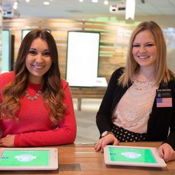 From left, sister missionaries Emily Hansen of McKinney, Texas, and Valerie Christensen of Yakima, Washington, prepare to use their iPads in the new Family Discovery Center in Salt Lake City.