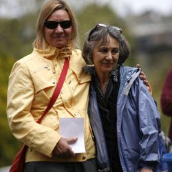 Amy Elliott hugs her sister Alice Elliott during a memorial service to honor 142 people who gave their bodies to science and education at the University of Utah last year at the Salt Lake City Cemetery in Salt Lake City on Friday, May 27, 2011. Their mother donated her body.