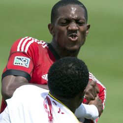 Toronto FC defender Doneil Henry, top, scuffles with Real Salt Lake forward Robbie Findlay during the second half of an MLS soccer game in Toronto on Saturday June 29, 2013. Henry received a red card. (AP Photo/The Canadian Press, Frank Gunn)