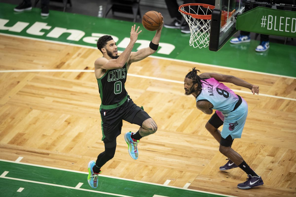 Jayson Tatum #0 of the Boston Celtics takes a shot over Trevor Ariza #8 of the Miami Heat during the second half at TD Garden on May 09, 2021 in Boston, Massachusetts. N