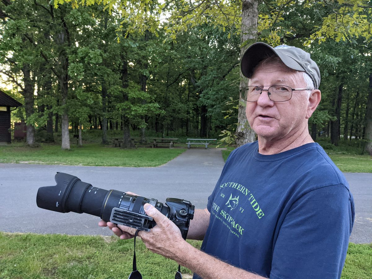 Les Winkeler demonstrates how best to use his camera and telephoto lens at Crab Orchard NWR. Credit: Dale Bowman